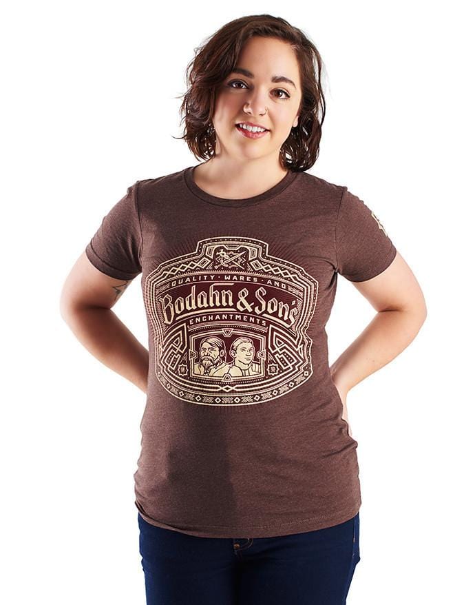 Bodahn and Sons shirt, featuring an image of the father-son duo with a Dwarven design around it, and the name of their shop. Worn by a model.