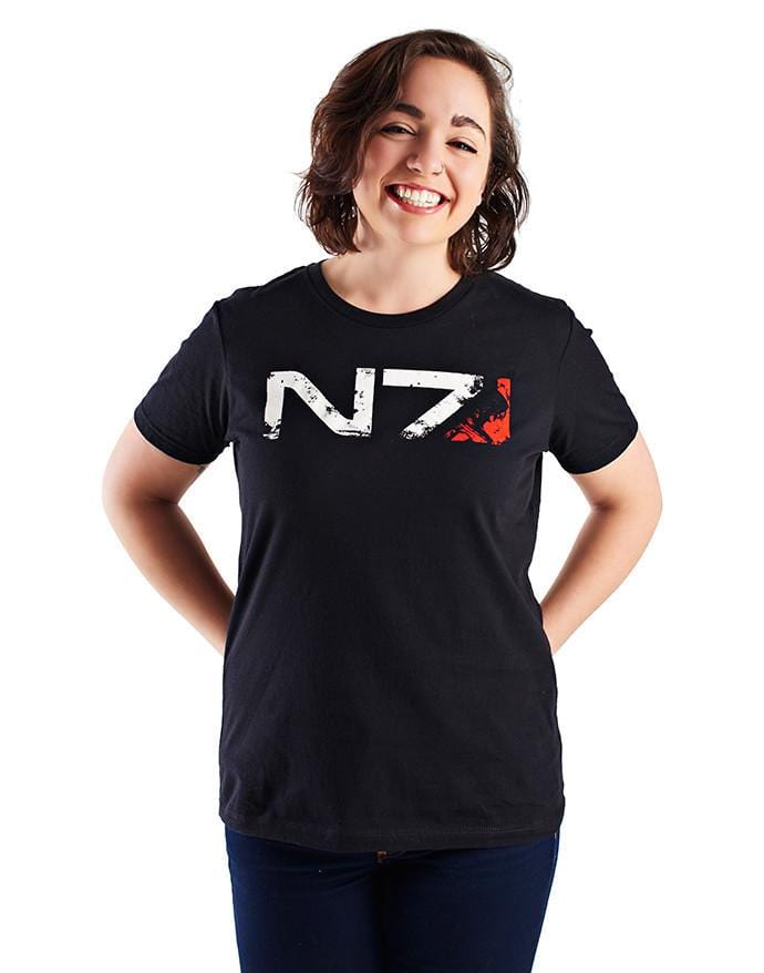 An image of the N7 Commander F-Shep Shirt. It is a black shirt with the N7 logo across the front in weathered-looking print, with f-Shep's face silhouetted in the red portion at the end.