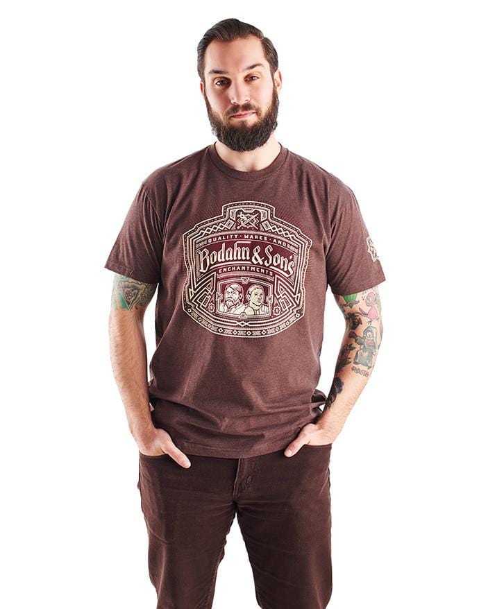 Bodahn and Sons shirt, featuring an image of the father-son duo with a Dwarven design around it, and the name of their shop. Worn by a model.